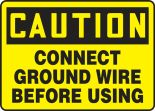 Safety Sign, Header: CAUTION, Legend: CONNECT GROUND WIRE BEFORE USING