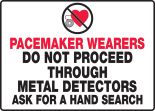 PACEMAKER WEARERS DO NOT PROCEED THROUGH METAL DETECTORS ASK FOR A HAND SEARCH (W/GRAPHIC)