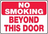 NO SMOKING BEYOND THIS DOOR
